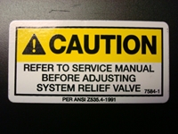 Caution Adjusting System Relief Valve